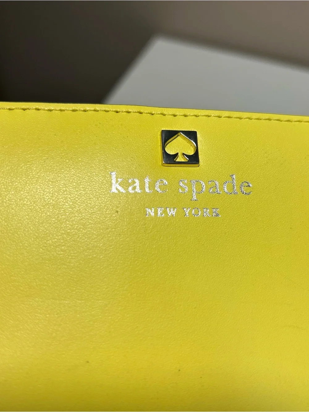 kate spade Yellow Leather Slim Bifold Wallet